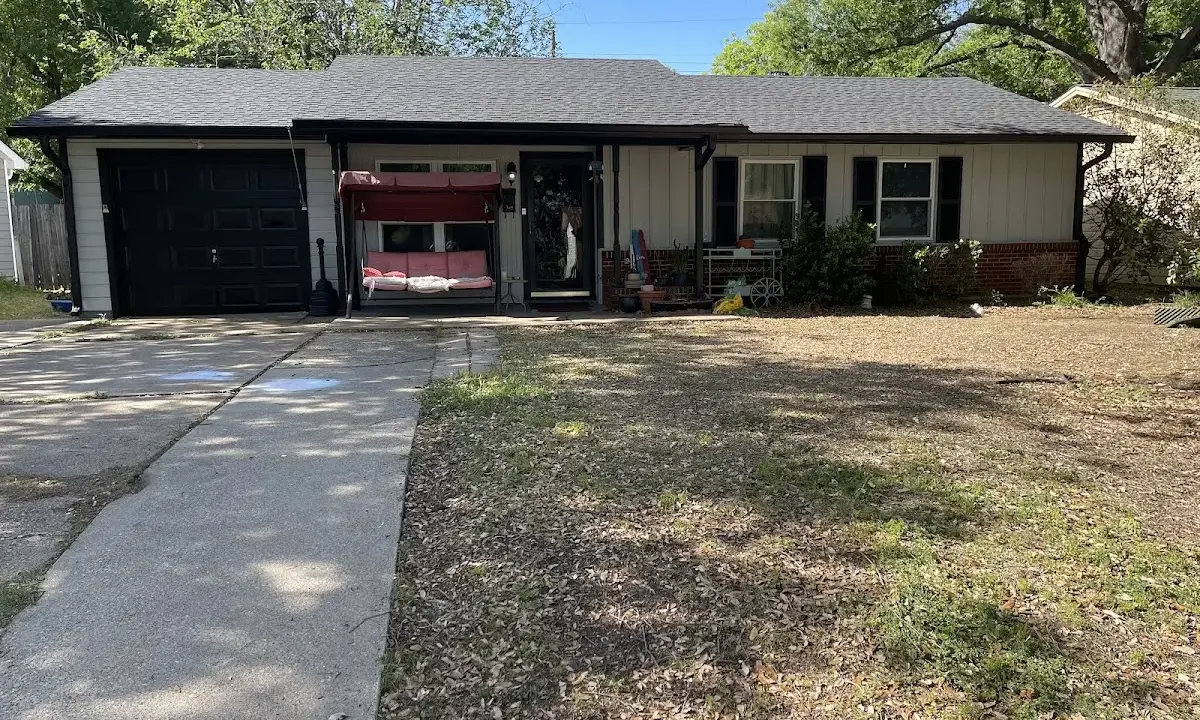 Asphalt Shingle Roof Repair crew at work on a residential roof in Sulphur Springs